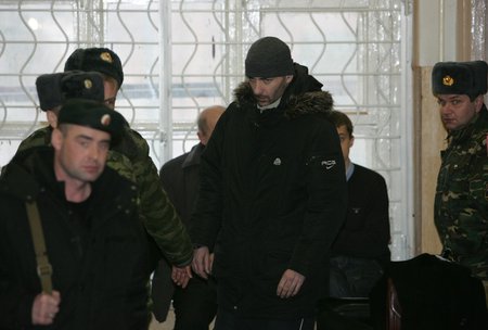 Vasily Alexanyan being escorted by guards