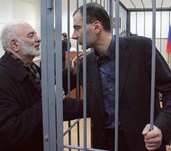 Vasily Alexanyan is talking to his father Georgy Alexanyan through prison bars